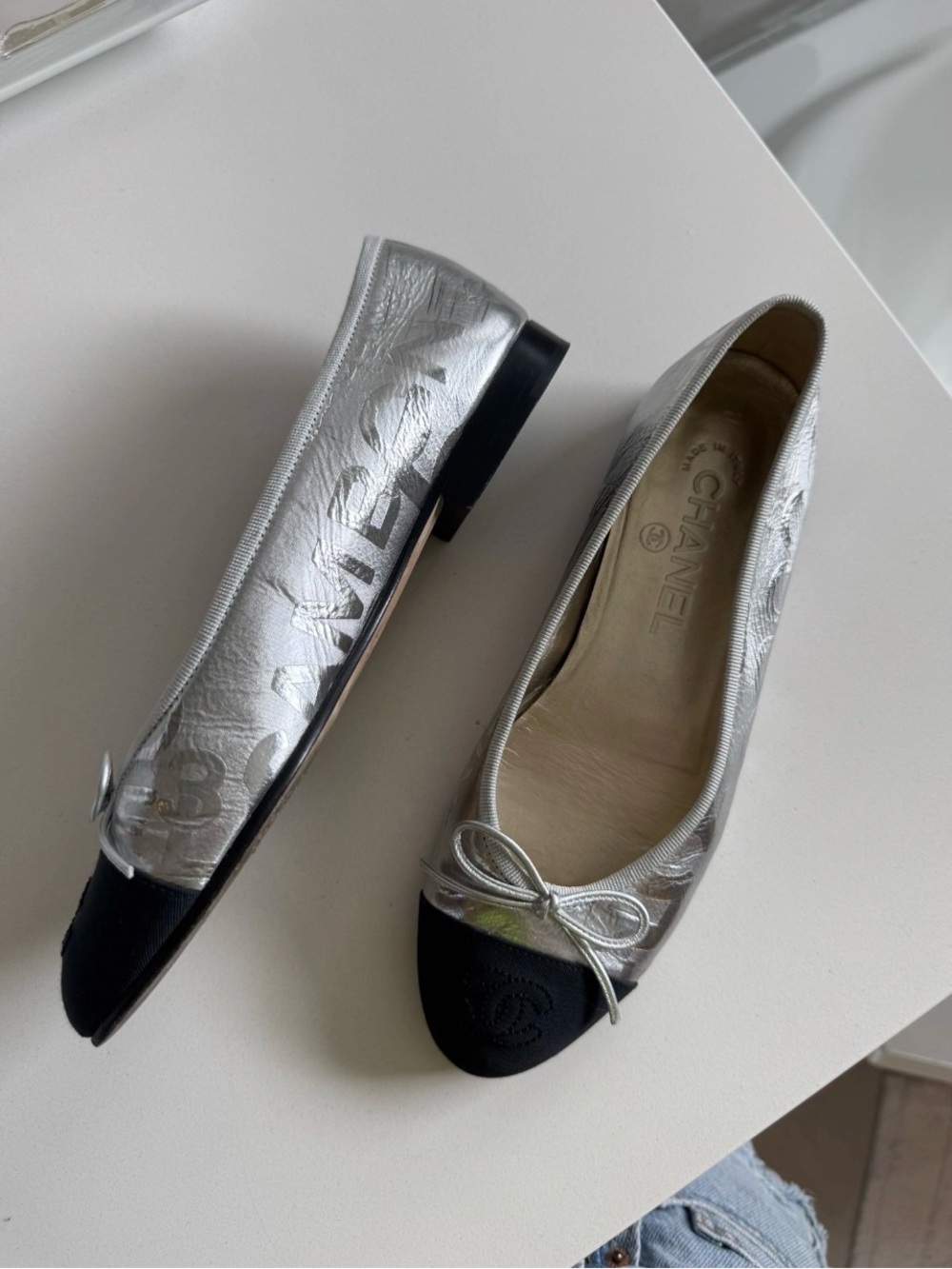 CHANEL Silver Leather Ballerina Flats with Black Cap Toe